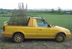 9 obelisks departing in a lovely yellow pickup (want one!)